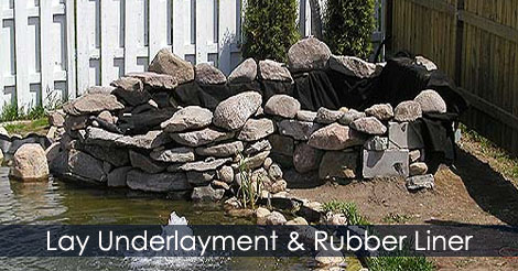 How to build a waterfall - Lay fabric underlayment and rubber liner - Place the rocks for edging upper pool pond waterfall