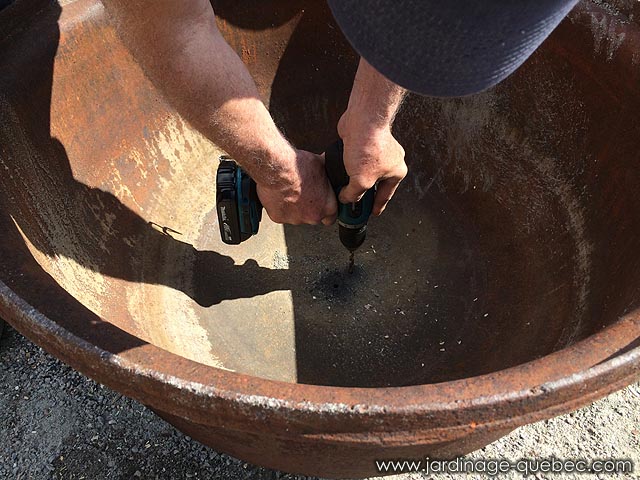 Drill drain holes in a cast iron cauldron